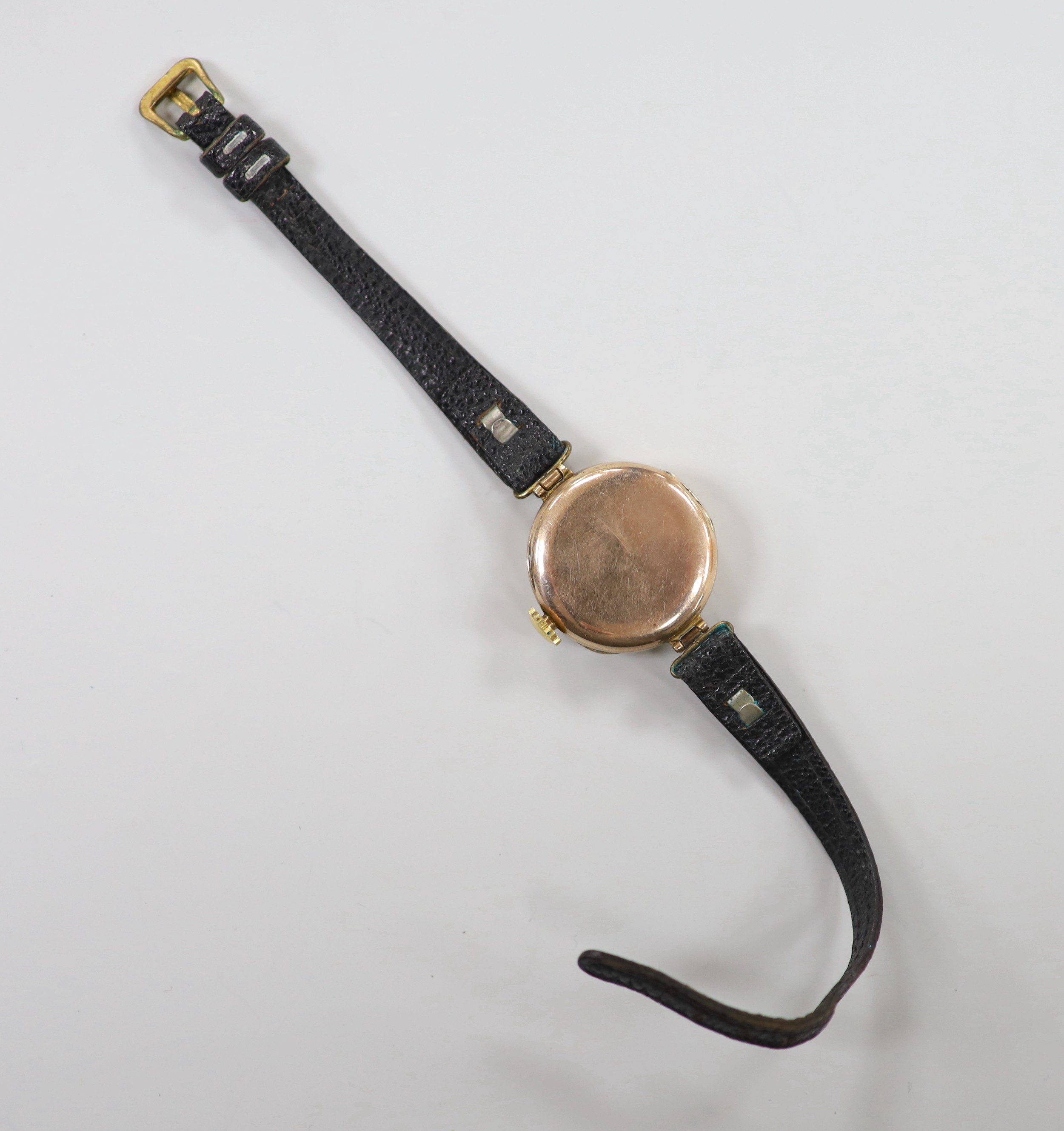 A lady's late 1920's 9ct gold Rolex manual wind wrist watch, with sunburst Arabic dial, on associated leather strap, case diameter 27mm and a fob watch.